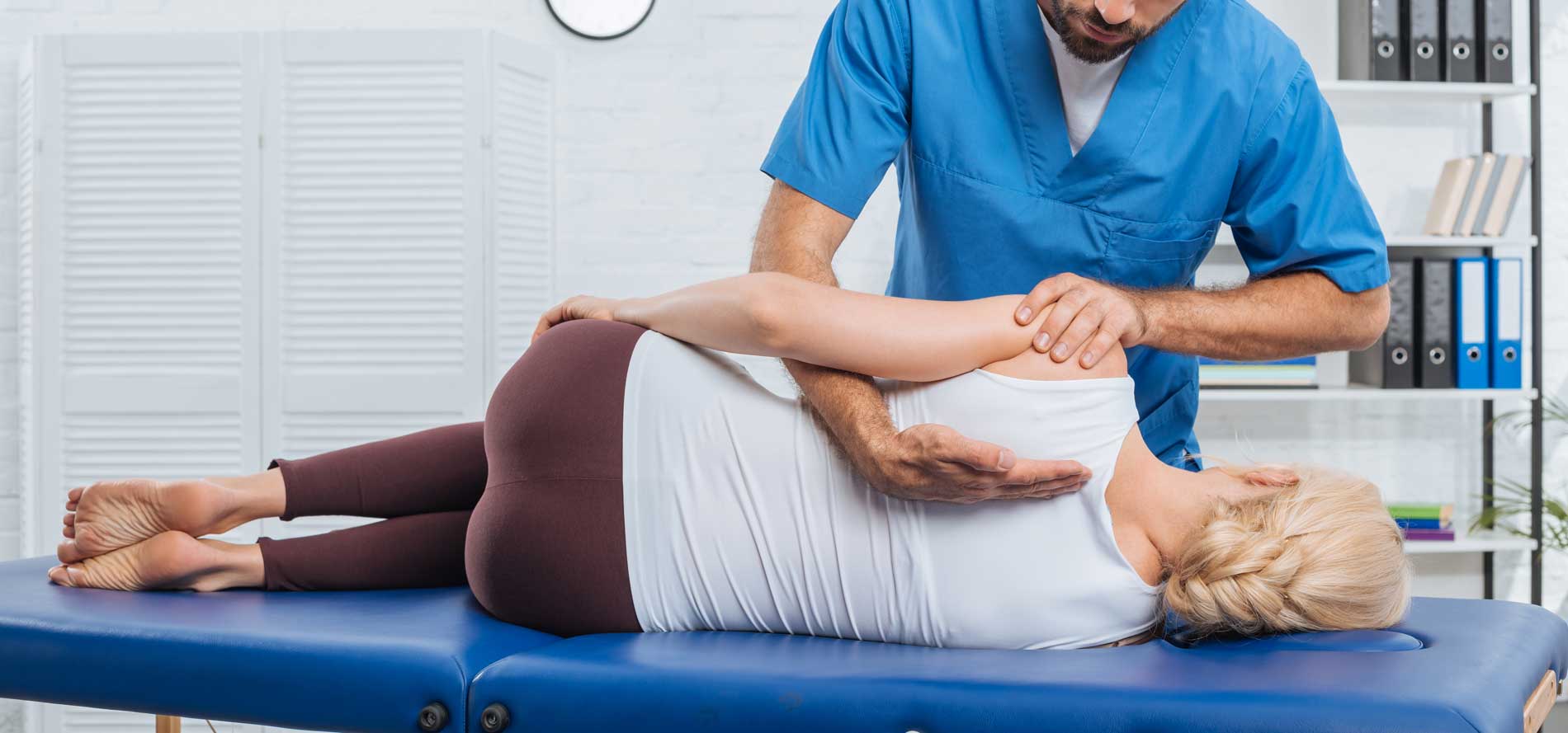 professional-osteopath-worker-giving-back-and-hip-treatment